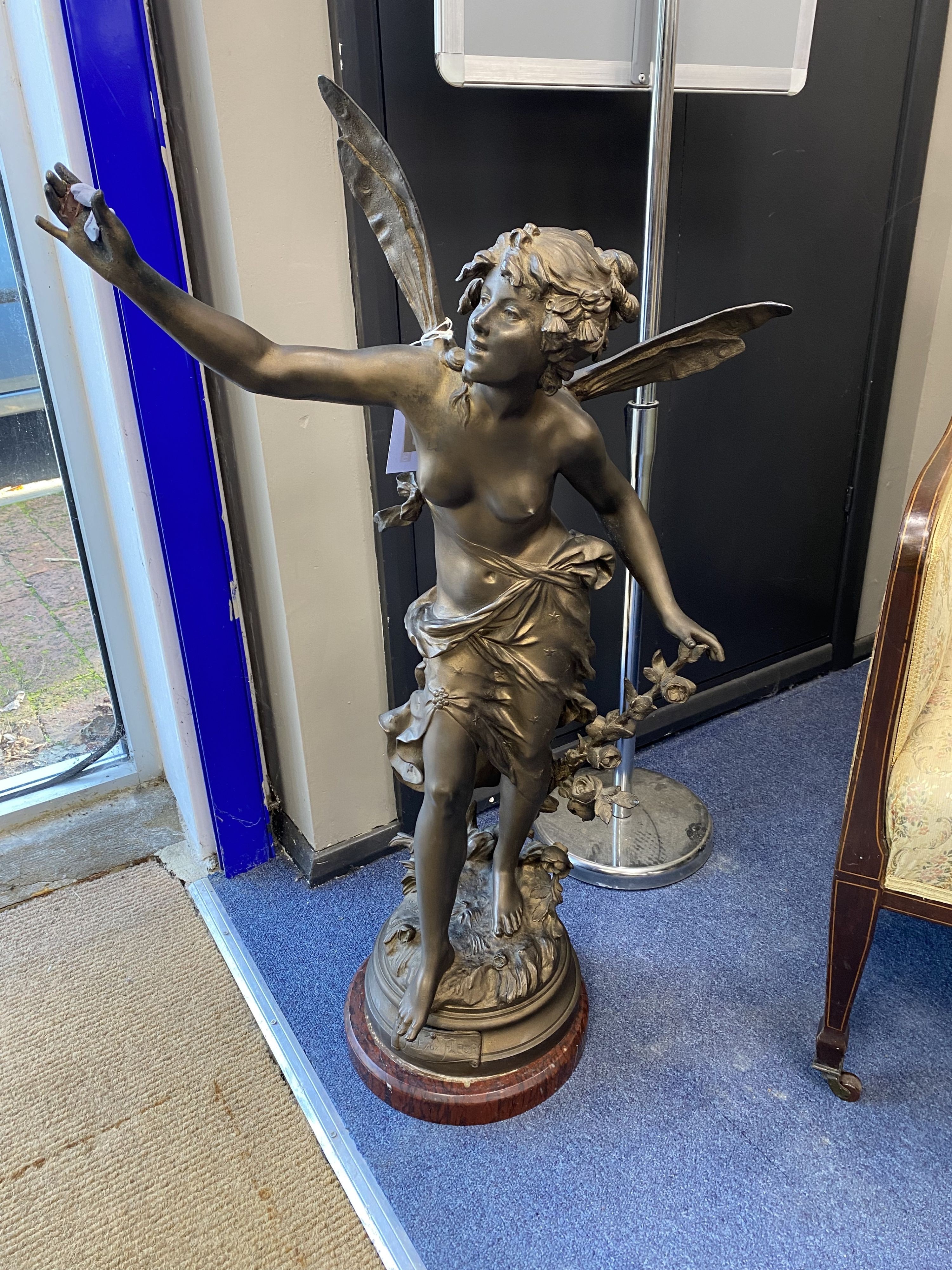 A 'Fee Aux Fleurs' cast bronze spelter fairy statue on marble base, height 90cm